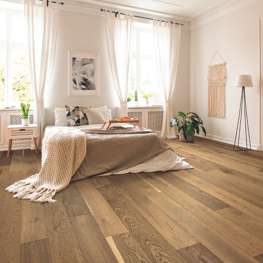 wide plank hardwood flooring in bedroom boho design